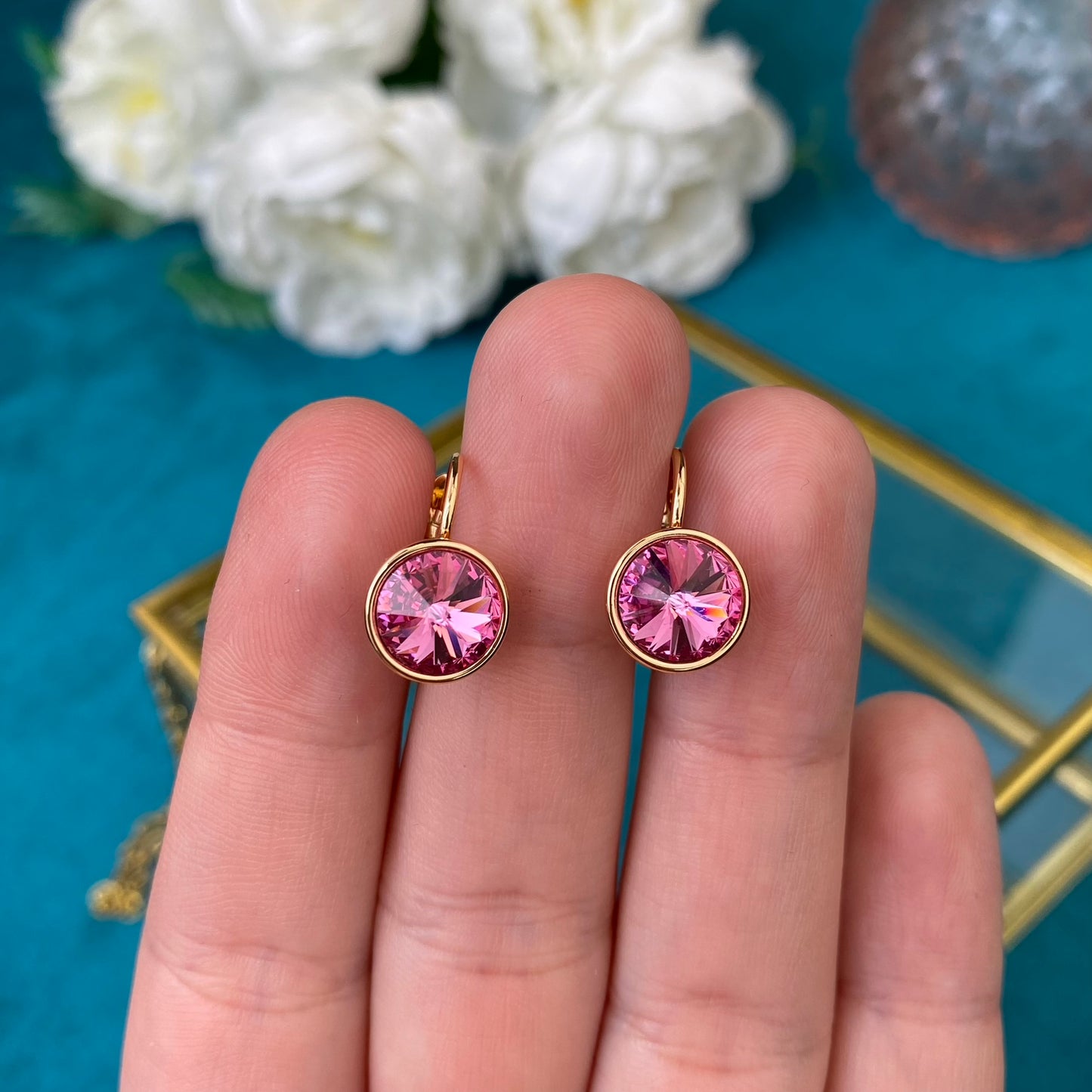 Vergoldete Ohrringe mit rosa Zierkristall
