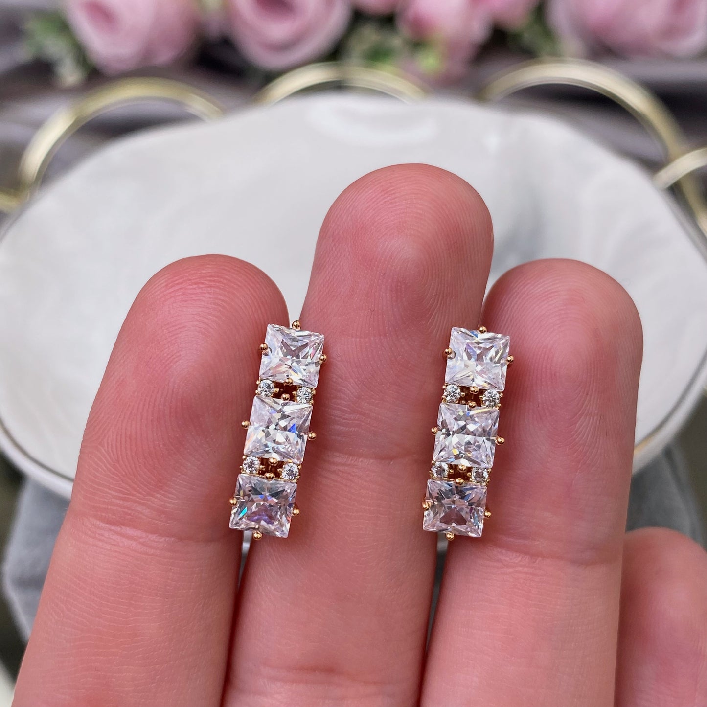 Gold plated earrings with white decorative crystals